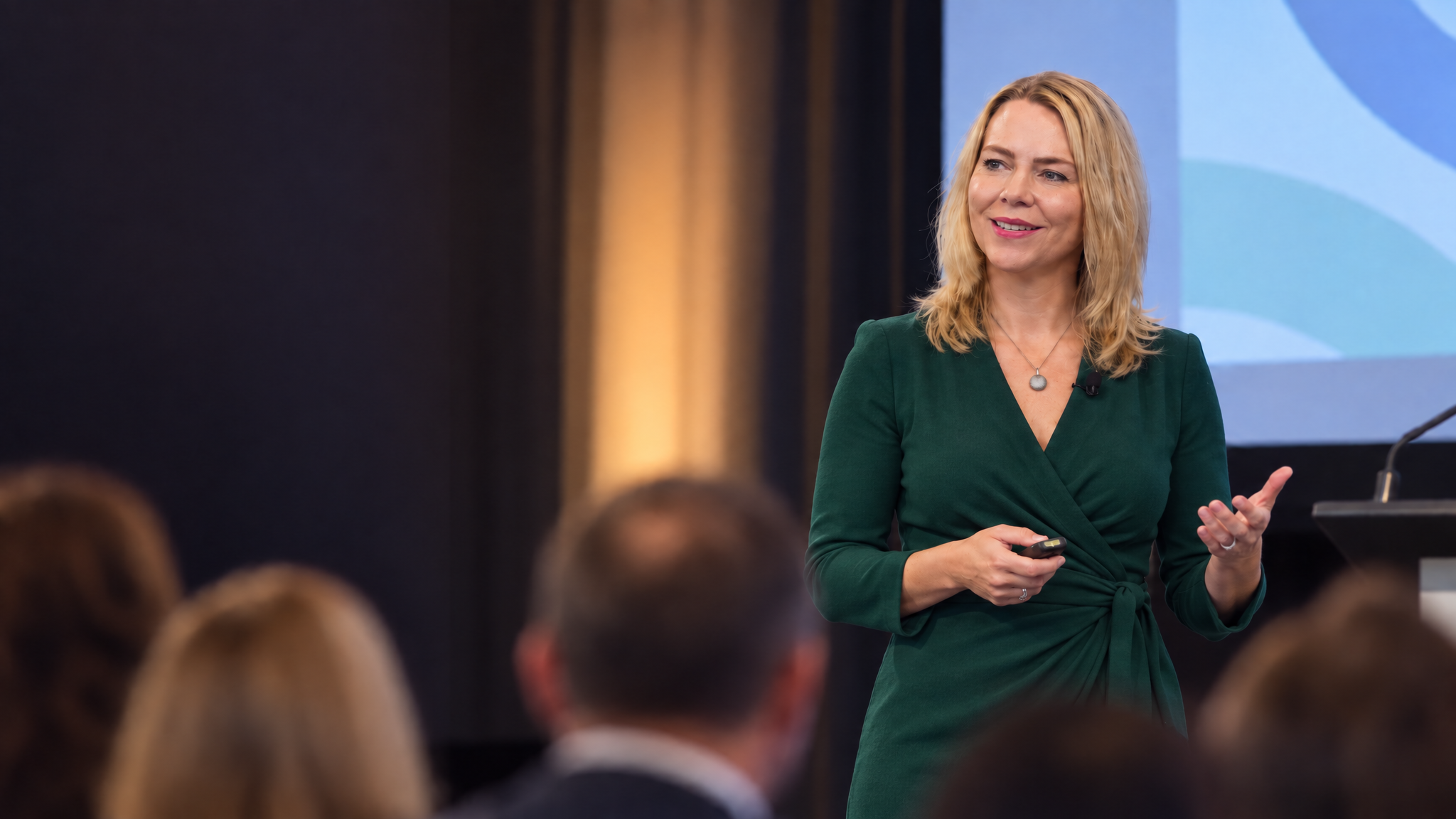 Monika Gietz presenting to an audience at a conference